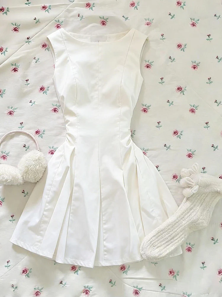 white sleeveless pleated dress